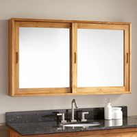 Complete your bathroom remodel with the 47" Wulan Teak Medicine Cabinet. This durable cabinet has ample storage space for your bathroom essentials and features sliding mirrored doors with recessed handles.