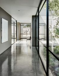 A hot-water radiant heating system is embedded in the polished concrete floors, finished to look like worn leather.