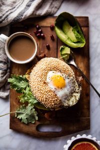 {Egg in a hole avocado, bacon, egg and cheese bagel.}