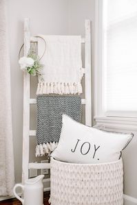 Easy to achieve farmhouse style with a whitewashed blanket ladder! Hang blankets, wreaths, decorate, and add some convenient storage.