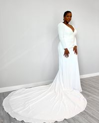 This minimalest fit-and-flare isn't only elegant, it's comfortable! The jersey lining will have you feeling FABULOUS all day long! Click through to see it without sleeves! #crepeweddinggown #minimalistbridaldress #vneck #vback #fitandflareweddingdress #fernandamaggiesottero #maggiesottero