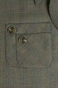 How to Make a Piggyback Pocket: double pockets for retro styling from Threads. I love the idea but I'm not totally sold on this style.