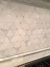Backsplash Tile above Range. The honed mosaic pattern backsplash above the range has circle mirror inserts. Backsplash Tile above Range #Backsplash #Tile #Range Beautiful Homes of Instagram Sumhouse_Sumwear
