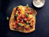 Spicy Merguez Scramble with Lemon-Harissa Yogurt and Moroccan M’smen