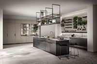 An hanging storage structure (with visible dish-rack) and professional extraction create new volumes. Compositional rigour, to respect your food preparation systems, washing, chopping and cooking, just like in a large, professional kitchen.