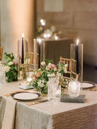 Shimmering Warmth Richly-textured fabrics, including velvet and jacquard table linens and silk shantung napkins, were embellished by wintery, jewel-toned accents within the tablescape: deep-sapphire taper candles in gold holders, glittering faceted glassware, and abundant emerald and snow-white florals.