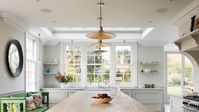 Large kitchen dining area with replacement timber weighted box sash windows
