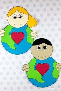 Girl and boy holding our Earth craft for Earth Day. #earthdaycraftsforkids #earthdaycraftforkids #earthdaycraftsforpreschoolers #earhdaycraftsforkidspreschool #heartearthcraft