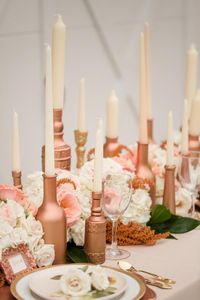 Rose gold candleholders mixed with fresh flower tablescape
