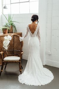 The deep V-back on our lace Antonia wedding gown is both flattering and chic.