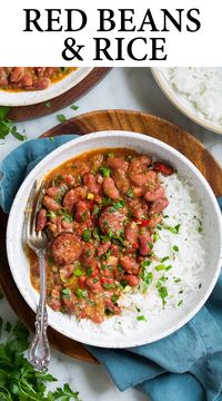 Red Beans and Rice - perfectly hearty Louisiana style comfort food at it's best! Red beans and smoked sausage are cooked low and slow with flavorful cajun spices, then served with fresh cooked rice to create a homestyle dinner recipe you'll crave again and again! #redbeans #rice #beans #southern #recipe #comfortfood #dinner