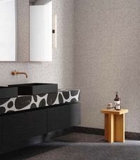 This is how to do monochrome with a difference. Jesper Mellgren from #notedesignstudio brings together large and small spotted surfaces to create a chic 1001 Dalmatians-inspired bathroom, enhanced by the simplicity of our NEA wall light alongside contrasting copper fittings and a carefully placed oak bench.