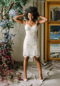 This intricate lace sheath features a graceful organic floral and leaf pattern with insets of...