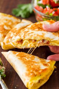 Breakfast quesadillas are the easiest one-pan breakfast and take minutes to make. Change up the egg quesadillas with sausage, bacon, or sliced deli ham.