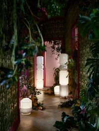 Pair interesting lighting elements with hints of green along the passageway leading to the terrace. This will not only set the mood but also give a hint of things to come. Image courtesy, IKEA