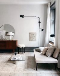 Each arm extends from a fixed-length down rod assembly and varies in length, allowing light to be distributed throughout the room. The tiltable heads can articulate up and down in a 270° rotation.