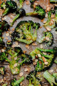Crack Broccoli. Roasted broccoli with toasted almonds, lemon, red pepper flakes, and pecorino. This side dish is so addicting! #SideDishRecipes #BroccoliRecipes #RoastedVegetables #ABeautifulPlate