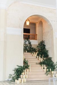 stairwell with greenery and candles