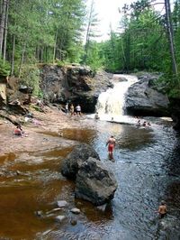 This wonderful camping location is in South Range, Wisconsin, at Amnicon Falls State Park which has a series of waterfalls and rapids. There are lovely pedestrian bridges from which you can look down on the water.