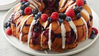 Fans love our timeless Grands!™ Monkey Bread (and so do we!). And while we enjoy the original recipe year-round, we wanted to give it a few sweet twists to help upgrade your spring brunch parties. We swapped biscuits for cinnamon rolls and added fresh berries to this dish, drizzling it all with a cream cheese-almond icing. We used a mixture of berries in this recipe, but feel free to experiment and make this monkey bread with one type of berry, like raspberries, too!
