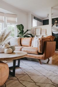 The Timber charme tan corner sectional demands your attention. Photo by Jessica Sara Morris. #SoftSofa #TanLeatherCouch #ModernLivingRoom #PetFriendlyFurniture #DurableSofa