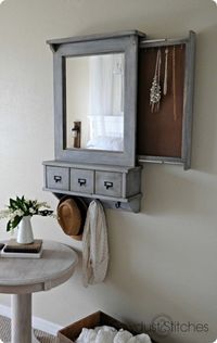 Add a pull-out organizer behind your entryway's mirror to hang jewelry.