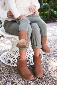 Mommy + me in matching UGG boots.