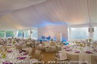 4. This corporate event had a polished look with a white ceiling liner and matching pole drapes.