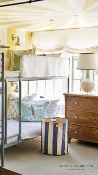 ASHLEY GILBREATH INTERIOR DESIGN: With extra company around the holidays it's always nice to have extra sleeping space, especially for littles. Tucked behind drapery this little sleeping nook is perfect for kids with fun bunk beds, tented painted ceiling, and individual scones above each bed.