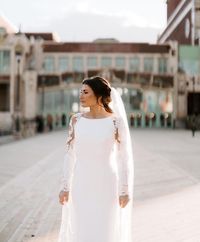 Beautiful illusion cut-out sleeves accent this sleek and classy Chardon crepe wedding dress complete with a bateau neckline and sheath silhouette! Love it? HAVE to try it on? We don't blame you! Click through to find it in a store near you! #minimalistweddingdress #crepebridalgown #longsleevebridaldrss #bethanyrebeccaingram #maggiesottero