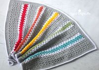 If you’re looking for a crochet stitch that works up fast and is easy to master, the v-stitch is perfect! And I love how one row of v-stitches looks like a zig-zag. You could alternate colors every row, make blocks of colors, or stripes. This baby blanket was made for my friend Shannon (you may remember her from …