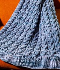 Ravelry: Reversible Cabled Blanket pattern by knitculture.com