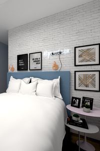 Quarto casal jovem aconchegante e criativo. Decoração com quadros decorativos e parede de tijolinhos. Projeto Em Canto Meu