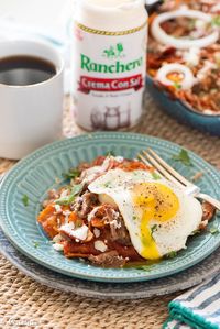 Carnitas Chilaquiles with Cacique Four Quesos Blend Shredded Cheese, Cotija, and Crema con Sal