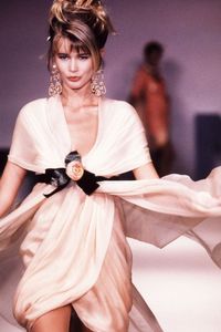 Getty Images 1989 Claudia Schiffer walks the runway at the Spring/Summer Haute Couture show in 1989 wearing the perfect blush dress and drop earrings.