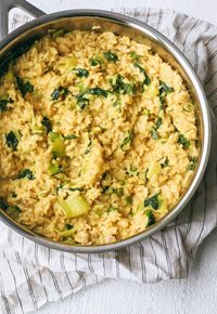 Super creamy coconut milk turmeric rice with bok choy and spinach. The perfect anti-inflammatory, warming side dish! #warmingdiet #antiinflammatory #turmeric #rice #bokchoy #sidedish #easyrecipes #cleaneating #vegan #veganrecipes #vegetarian #glutenfree #glutenfreerecipes #dinner #coconutmilk #creamy