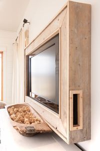 DIY rustic style framed television! The TV frame is made from weathered wood and it took us an afternoon to create this look! #TweveOnMain #farmhousedecor #rusticdecor #diyproject