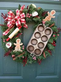 Decorating wreathes with festive items like these gingerbread men is a brilliant way to create yourself a unique decorative piece.