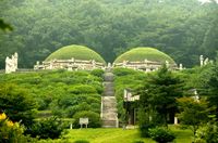 This tomb is in North Korea and is called "King Gongmin's & Mongolian Princess Nogook Mausoleum" or "Hyunjeongreum" in Kaesong. It is made in granite and has a draining system. It even has a road to it, similar to necropolis'. The road only buried high positioned people, however, such as the military officers and Confucian officials.