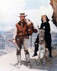 Size: 10x8in Two Mules for Sister SaraChoose from our catalog of over 500,000 posters! Shirley MacLaine as Sara and Clint Eastwood as Hogan in Two Mules for Sister Sara