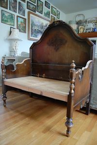 Bench made of twin size headboard and footboard. If you found the bed at a garage sale this would be an affordable way to get that "awesome antique bench" look.