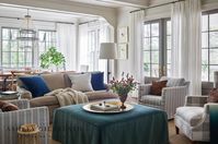 ASHLEY GILBREATH INTERIOR DESIGN: An elegant and family friendly living room with it's pops of color and performance upholstered fabrics this is a space even the dogs are welcome to hang out. The set of double french doors over look the pool and back patio while the view from the breakfast room looks straight out to the lake. We love the architectural detail of the crown molding that separates the living and breakfast rooms giving an old charm feeling. architect Brandon C Ingram