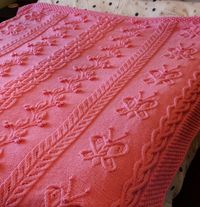 Free Knitting Pattern Butterfly Cabled Blanket - Joan Barnett designed this breathtaking cable afghan for Red Heart with 4 different cable patterns and a Bramble Stitch border. 58 x 66″ (147.5 x 167.5 cm)