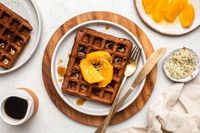 These Chocolate Orange Waffles are crispy outside and soft & fluffy inside. Turn your dessert-for-breakfast dreams into reality with this chocolatey treat!