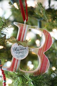 Wooden letter Ornament - easy gift to put together, get inexpensive wooden letters from the craft store and Mod-Podge fun scrapbook paper on, add a hook and ribbon