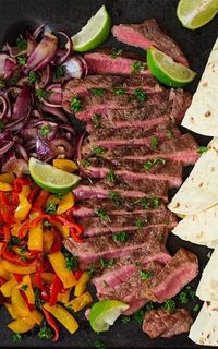 Enjoy your own Tex-Mex feast at home with this super-easy recipe for Margarita Steak Fajitas! Tequila and fresh lime juice are part of a marinade that gives these steak fajitas their bright flavor. #steak #fajitas #texmex #mexican #dinnerideas #easyrecipe