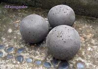 Garden Spheres! They made small spheres using small rubber balls cut open... put in quikcrete... leave 24 hours, remove ball.... Myself, I want to try with a BIG ball to have awesome homemade garden seating!