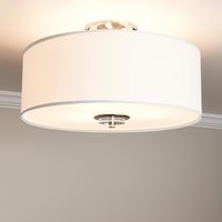 A traditional design makes the Bankloft Semi-Flush-Mount Ceiling Light Fixture ideal for a timeless home. This product features a trio of lights that shine brightly within the drum-style shade, which is made of fabric and is white in color. A frosted-glas