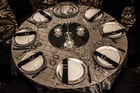 Bling Wedding Decor #wedding #decor #reception #lethbridgeeventrentals #lethbridgeevents #catering #events #blackandwhite #elegant #uplight #rosetteskirt #beadedcurtain #backdrop #pintuck #bling