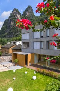 Situated amid the mountainous landscape of Yangshuo in China, architecture studio Fabersociety has designed a new boutique hotel called the ‘GEEMU Resort’. The project sees the transformation of an existing structure to create a welcoming and child-friendly space. The architect has also strived to form a building that resonates with the community by exploring the local culture of the burgeoning area.